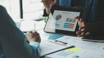 Financial Business team present. Business man hands hold documents with financial statistic stock photo, discussion, and analysis report data the charts and graphs. Finance Financial concept video