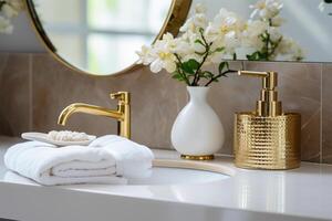 A beautiful sink with water turned on with a golden faucet photo