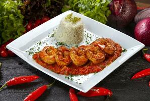 Large shrimp with tomato sauce photo