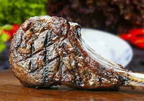 freshly grilled Tomahawk steaks photo