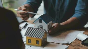 Image of team engineer checks construction blueprints on new project with engineering tools at desk in office. video