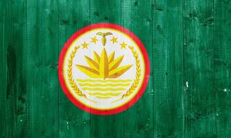 Flag and coat of arms of People's Republic of Bangladesh on a textured background. Concept collage. photo