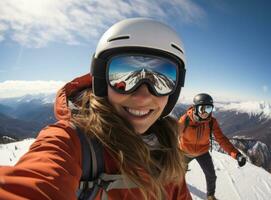 Skateboarder girls snowboarding on top of mountain photo