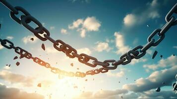 Conceptual image of broken chain against blue sky with white clouds photo