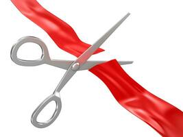 Scissors cutting red ribbon photo