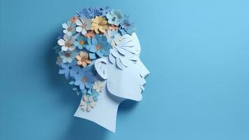 World mental health day concept. Paper human head symbol and flowers on blue background photo