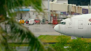 PHUKET, THAILAND NOVEMBER 26, 2016 - Thai airways Boeing 777 HS TKK accelerate before departure Phuket airport. video