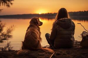 Young woman and her dog are sitting on the shore of a lake near a campfire in camp, enjoying an amazing view of the lake at sunset. Friendship between human and dog AI Generative photo