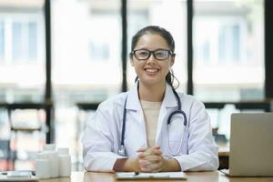 Confident smiling doctor posing and looking at camera. photo