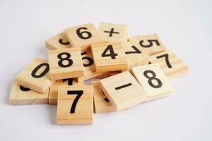 Number wood block cubes for learning Mathematic, education math concept. photo