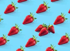 Ripe strawberries pattern. Food pattern. Blue background. photo