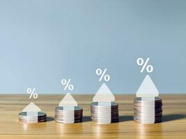 Interest rate and dividend with percentage sign and up arrow Interest rates continue to rise. Long-term investments for retirement. photo