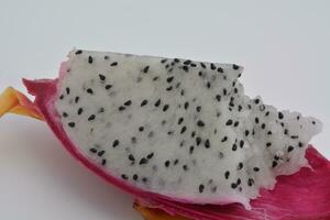 Dragon fruit, a fruit with many seeds, on a white background photo