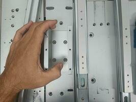 Tighten the stainless steel screws with a hex wrench. with left hand photo