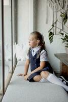 Primary school girl, in school uniform photo