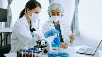 Scientist team meeting and writing analysis results in the laboratory study and analyze scientific sample for global warming, analytics and tech. photo
