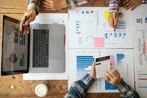 Top View and Copy Space, group of investors and business teams are discussing investment trends for best results. concept of hiring an investment consultant to get highly efficient investment advice. photo