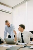 Creative managers crew working with new startup project in modern office. Team brainstorming. photo