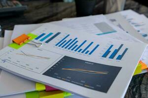 A huge stacked documents is an annual earnings summary document prepared for business people to use in attending meetings and this stacked paper is also an important document. photo