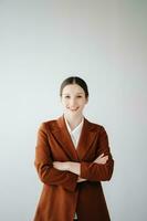 Smiling caucasian young businesswoman bank employee worker manager boss ceo looking at camera, using tablet, laptop and notepad online isolated in white background photo