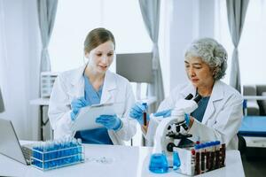 Scientist team meeting and writing analysis results in the laboratory study and analyze scientific sample for global warming, analytics and tech. photo