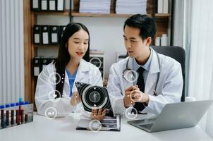 Medical technology network team meeting concept. Doctor hand working with smart phone modern digital tablet and laptop computer with graphics chart interface, with virtual icon diagram photo