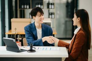 Consultation between a male lawyer and business customer, handshake after good deal agreement, Law and Legal concept.Good service cooperation photo