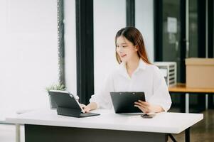 Project manager working and update tasks with milestones progress planning and Gantt chart scheduling diagram. business working with smart phone, tablet and laptop in office. photo