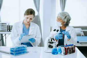 Scientist team meeting and writing analysis results in the laboratory study and analyze scientific sample for global warming, analytics and tech. photo