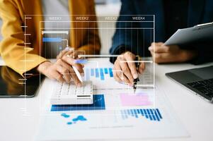 Project manager working and update tasks with milestones progress planning and Gantt chart scheduling diagram.business tram working at modern office photo