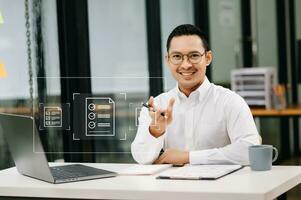 E-document management Paperless workplace, e-signing, electronic signature, document management. businessman signs an electronic document on a virtual notebook screen using a stylus pencil. photo