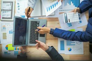 A group of businesspeople and investors meet to discuss market's success in past quarter. idea of setting up a marketing consulting team and working together as a team made it a success. photo