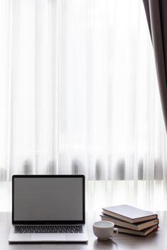 Notebook computers are geared up for online work because it's when companies allow working from home. The concept of working from home with Notebook via online system. Copy space for text photo