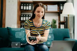 Caucasian woman sitting at a desk using a laptop computer and tablet Navigating Finance and Marketing with Technology in office with virtual icon photo