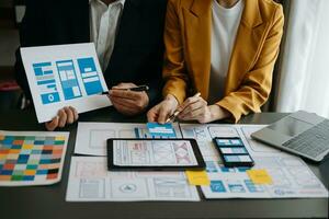 UX graphic designer planning application process development prototype wireframe for web smart phone. Creative digital development agency. photo