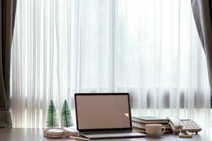 Notebook computers are geared up for online work because it's when companies allow working from home. The concept of working from home with Notebook via online system. Copy space for text photo