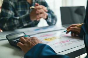 A group of investors and business teams are discussing investment trends for the best results. The concept of hiring an investment consultant to get highly efficient investment advice. photo
