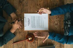 contract of sale was placed on the table in the lawyer office because the company hired the lawyer office as a legal advisor and drafted the contract so that the client could sign the right contract. photo