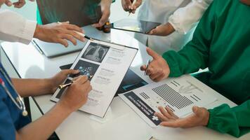 concept of mobilizing ability of medical team in conference room to diagnose and treat disease correctly. medical team joins meeting and discusses  patient illness in order to treat it correctly photo