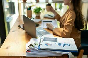 A huge stacked documents is an annual earnings summary document prepared for business people to use in attending meetings and this stacked paper is also an important document. photo
