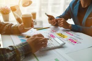 A group of investors and business teams are discussing investment trends for the best results. The concept of hiring an investment consultant to get highly efficient investment advice. photo