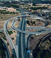 Aerial drone view of a large highway freeway interescting junction with on ramps and off ramps photo