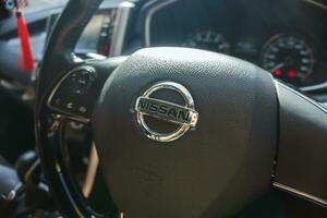 Jakarta, 13 July 2023 -  Steering wheel and front console close up of Nissan Livina photo