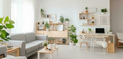 White open space flat interior with grey sofa, wooden cupboards with plants and decor, study corner desk with empty computer screen photo