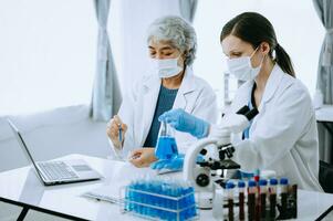 Scientist team meeting and writing analysis results in the laboratory study and analyze scientific sample for global warming, analytics and tech. photo