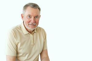 Confident stylish middle aged senior man isolated on white background with copy space. Older mature 70s man smiling. Happy attractive senior beard grandfather headshot portrait. Happy people. photo