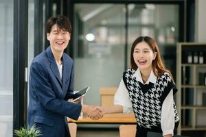 Two confident business man shaking hands during a meeting in the office, success, dealing, greeting and partner in sun light photo