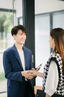 Two confident business man shaking hands during a meeting in the office, success, dealing, greeting and partner in sun light photo