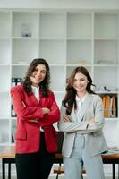 Business partners sitting at office and smiling at camera. Executives  successful business team photo