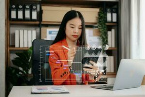 Woman hand Project manager working and update tasks and Gantt chart scheduling virtual diagram.with smart phone, tablet and laptop in office. photo
